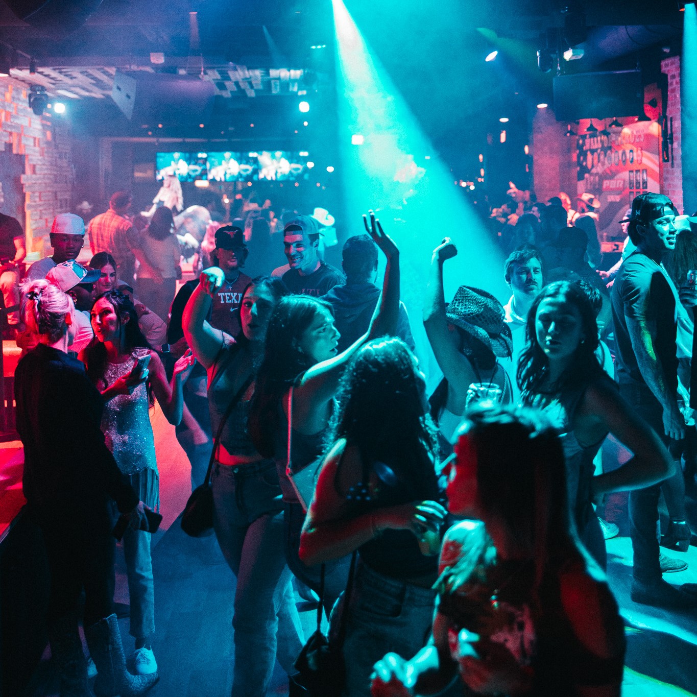 People on dance floor at PBR Cowboy Bar Nashville.